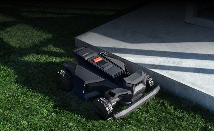 A Navimow i105E robot lawn mower sits on the lawn.