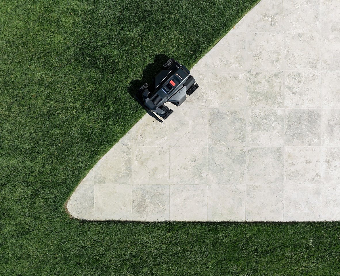 A Navimow i Series robot lawn mower on green grass.