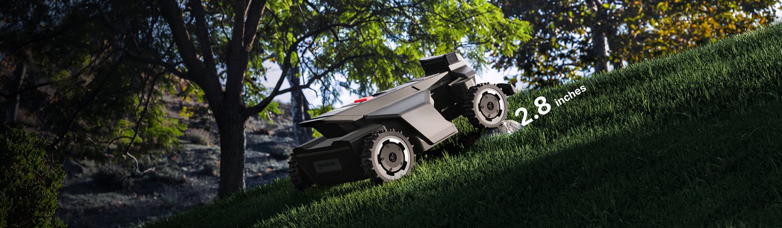 Navimow i110N robot lawn mower climbing a steep green hill.